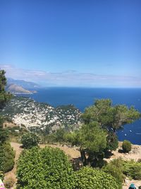 Scenic view of sea against blue sky