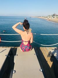 Rear view of woman looking at sea