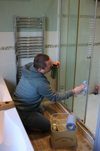 Side view of man working on table