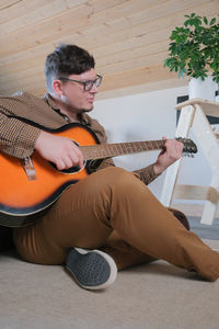 Young man playing guitar