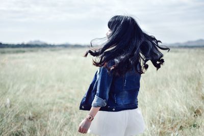 Woman walking on field