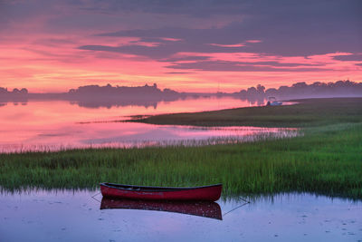 Intense pre sunrise sky illuminates coastal maine landscape