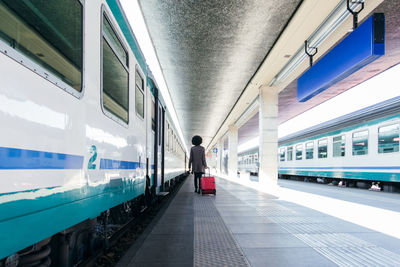 Tourist woman going for vacation trip on train