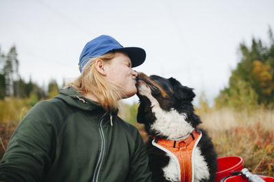 Man kissing dog