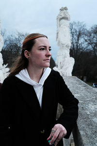 Portrait of young woman looking away