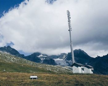 Scenic view of mountains against cloudy sky