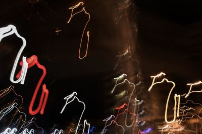 Low angle view of illuminated light painting at night