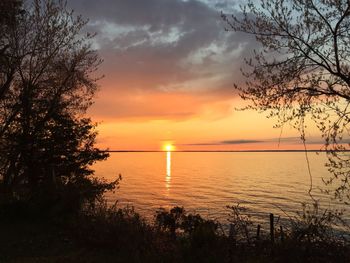 Scenic view of sea against orange sky