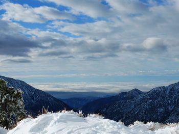 Scenic view of mountains against sky during winter