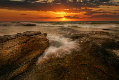 Scenic view of sea against sky during sunset