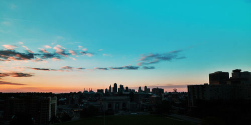 Cityscape against sky at sunset