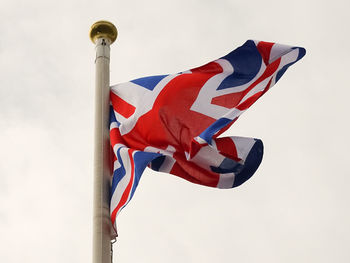 Low angle view of flag against sky