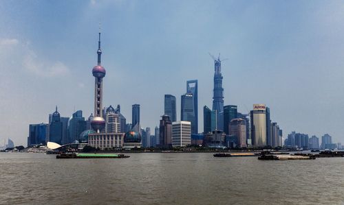 Modern buildings in city against sky