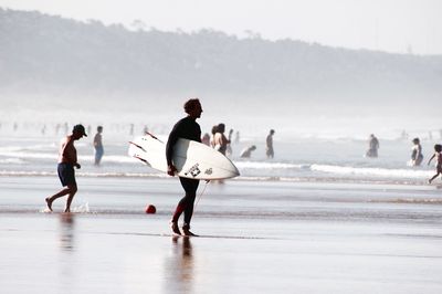 People enjoying at beach