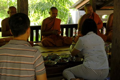 Rear view of people sitting in restaurant