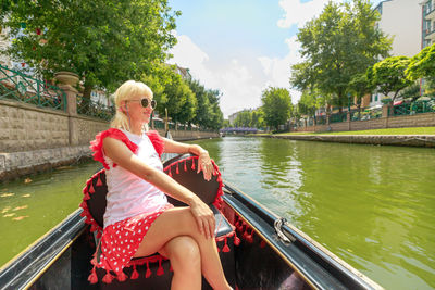 Portrait of woman sitting on boat