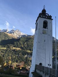 Panoramic view of buildings and mountains against sky