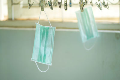 Close-up of clothespins on glass