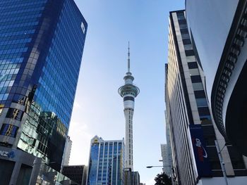 Low angle view of communications tower against blue sky