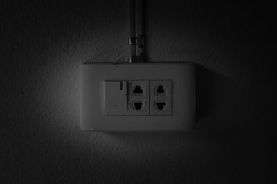 Close-up of electric lamp on wall