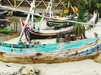 Boats moored in water