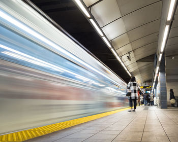 Blurred motion of train at subway station