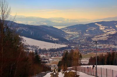 Aerial view of townscape against sky during winter