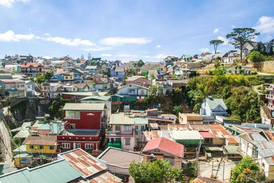 Stunning view of colorful hillside neighborhood filled with houses and buildings, dalat, vietnam.