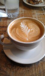 High angle view of cappuccino on table