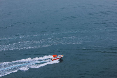 High angle view of people on boat in sea