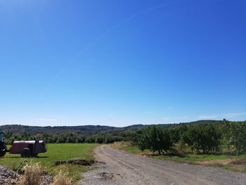 Scenic view of land against clear blue sky