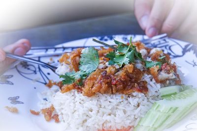 High angle view of person preparing food in plate