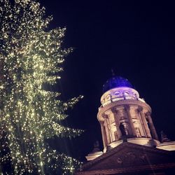 Low angle view of illuminated building at night