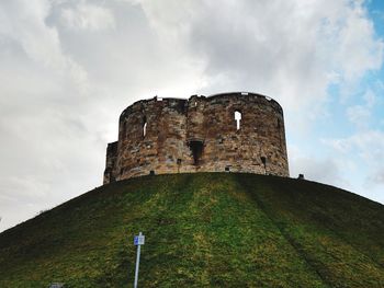 Low angle view of historic building against sky