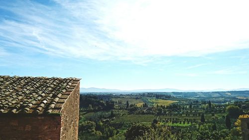 Scenic view of farm against sky