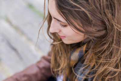 Close-up of smiling woman sitting on steps