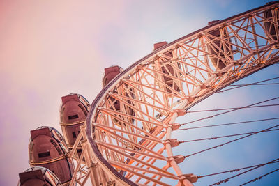 Low angle view of ferris wheel against sky