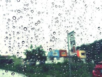 Raindrops on glass window during rainy season