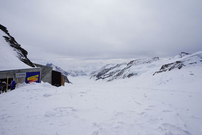 Snow covered mountains against sky