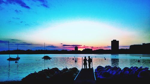 Silhouette of people at sunset