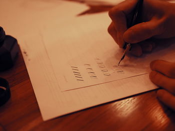 Close-up of human hand on table