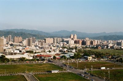 High angle view of buildings in city against clear sky