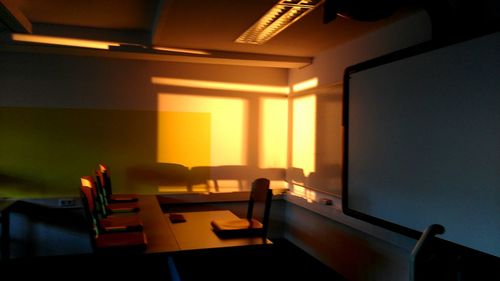 Chairs in illuminated room