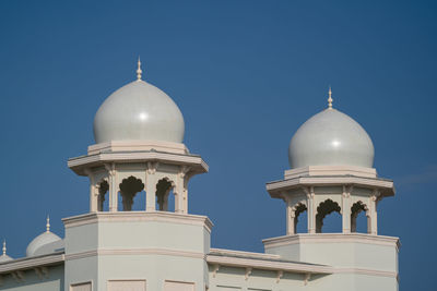 Low angle view of mosque against clear sky