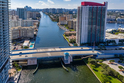 High angle view of bridge over canal amidst buildings in city