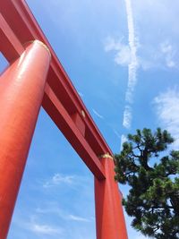 Low angle view of bridge and building against sky