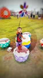 Boy playing with toy on field