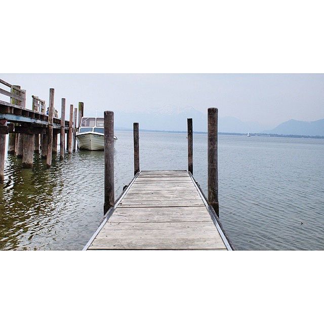 water, sea, pier, clear sky, tranquil scene, tranquility, the way forward, built structure, horizon over water, railing, copy space, scenics, long, sky, diminishing perspective, jetty, wood - material, nature, architecture, day