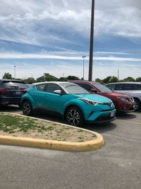 Car on street against blue sky