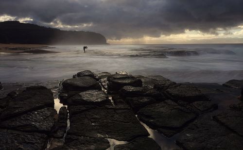 Scenic view of sea against cloudy sky